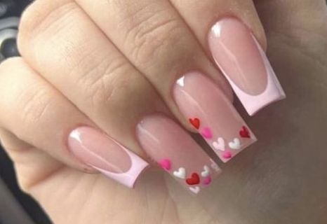 Square nails with pink French tips and hearts