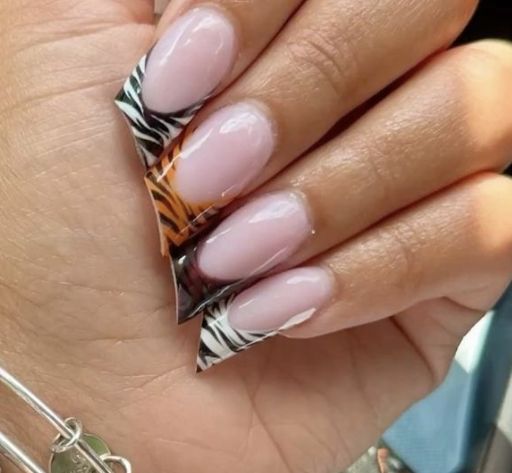 Lipstick shaped nails with multi animal print design